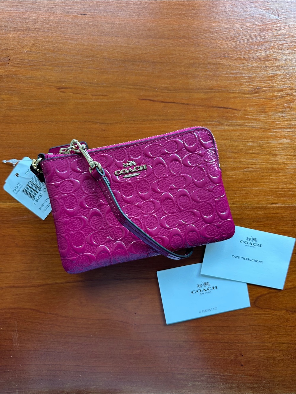 NWT Coach Cranberry Signature Embossed Wristlet with Gold Hardware